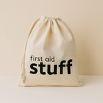 Natural 100% Cotton drawstring bag with 'first aid stuff' text on a beige background