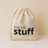 Natural 100% Cotton drawstring bag with 'first aid stuff' text on a beige background