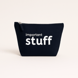 Navy pouch with 'important stuff' text on a beige background