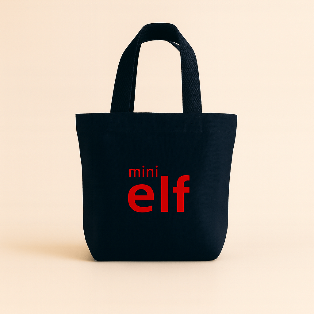 Navy tote bag with 'mini elf' text in red on a beige background