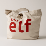Natural tote bag with 'big elf' text in red on a light background