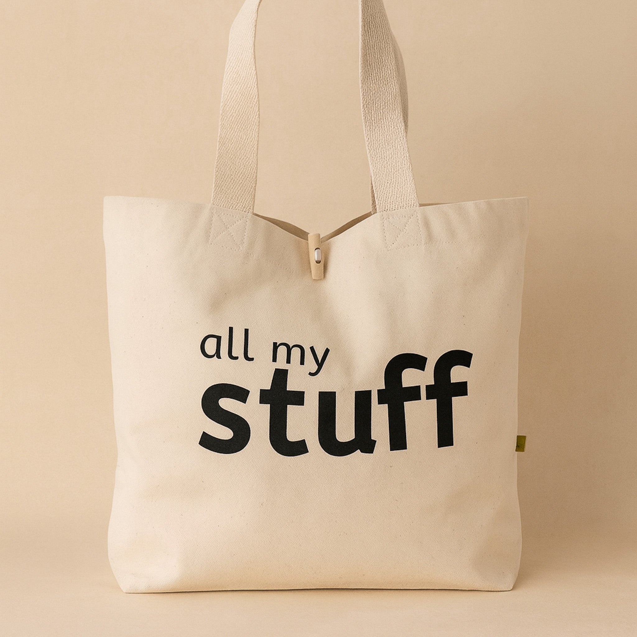 natural cotton canvas tote bag with 'all my stuff' text on a beige background