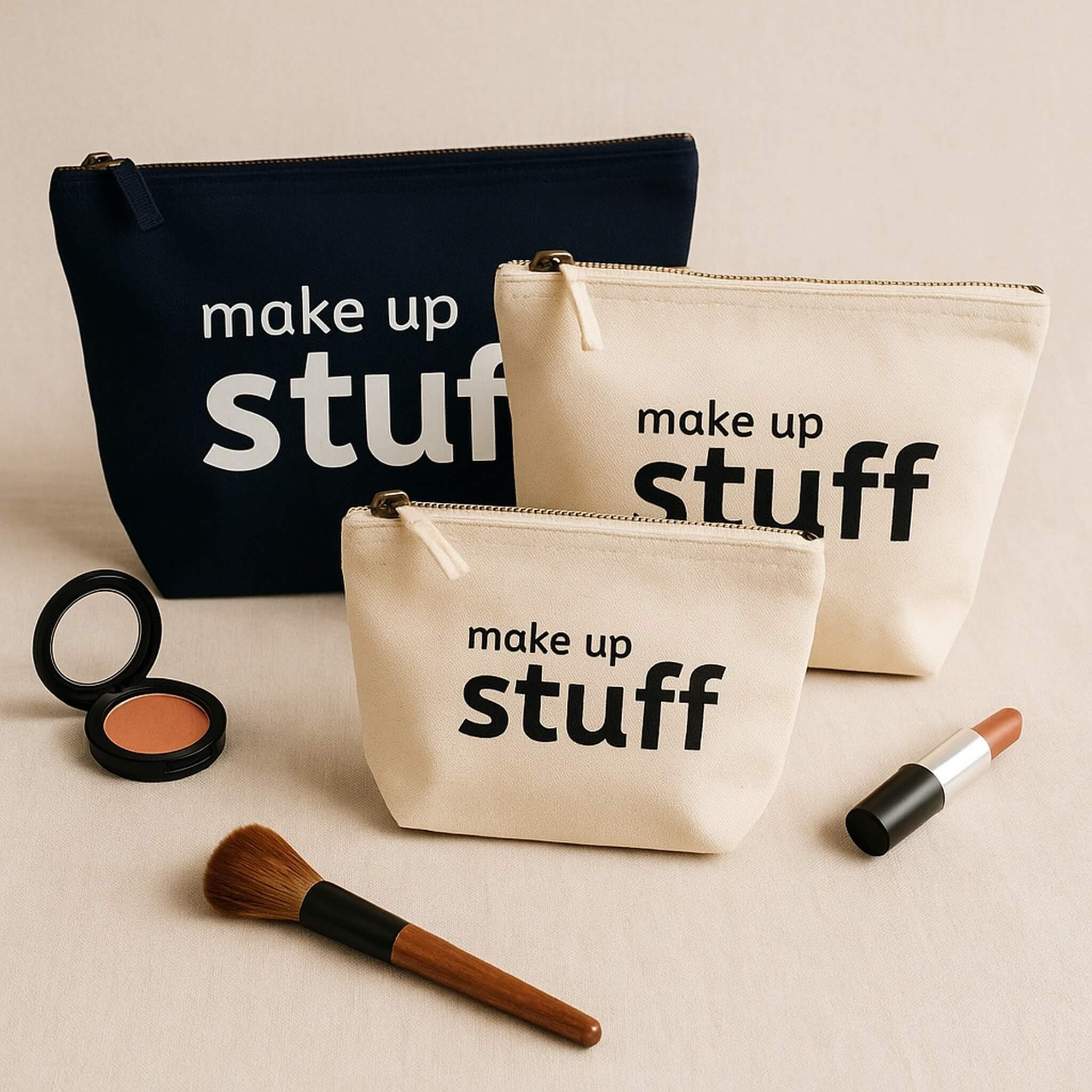 three make up bags with "make up stuff" text, styled on a neutral background with blush, lipstick, and brush props in soft natural light