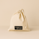 Natural drawstring bag with 'meemz & moo' label on a beige background